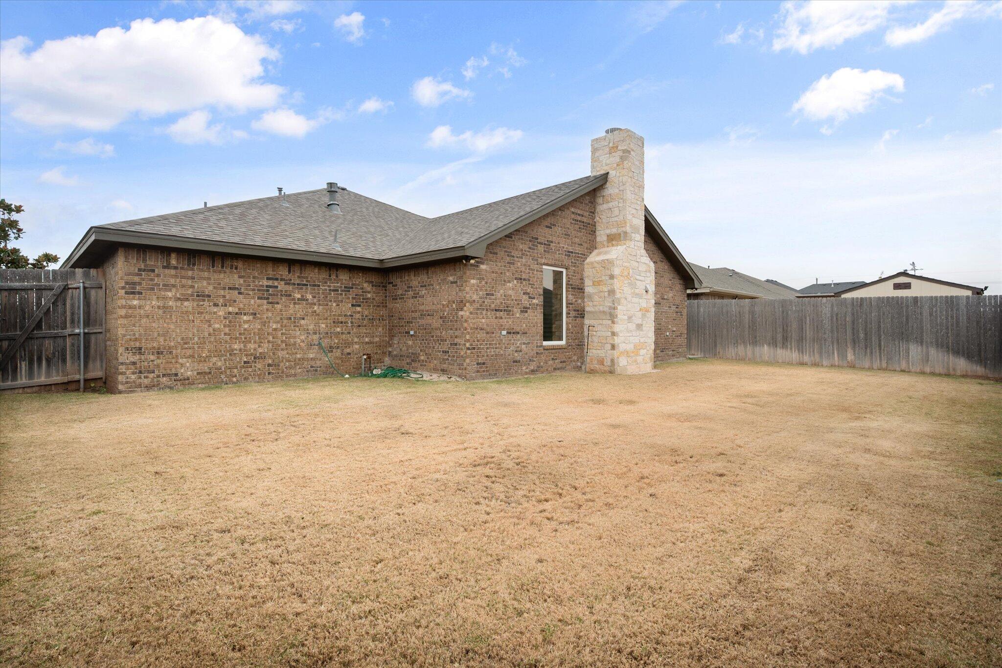 9606 Hope Avenue Lubbock, TX 79424 - Photo 34 of 35 a view of wooden floor in front of a house
