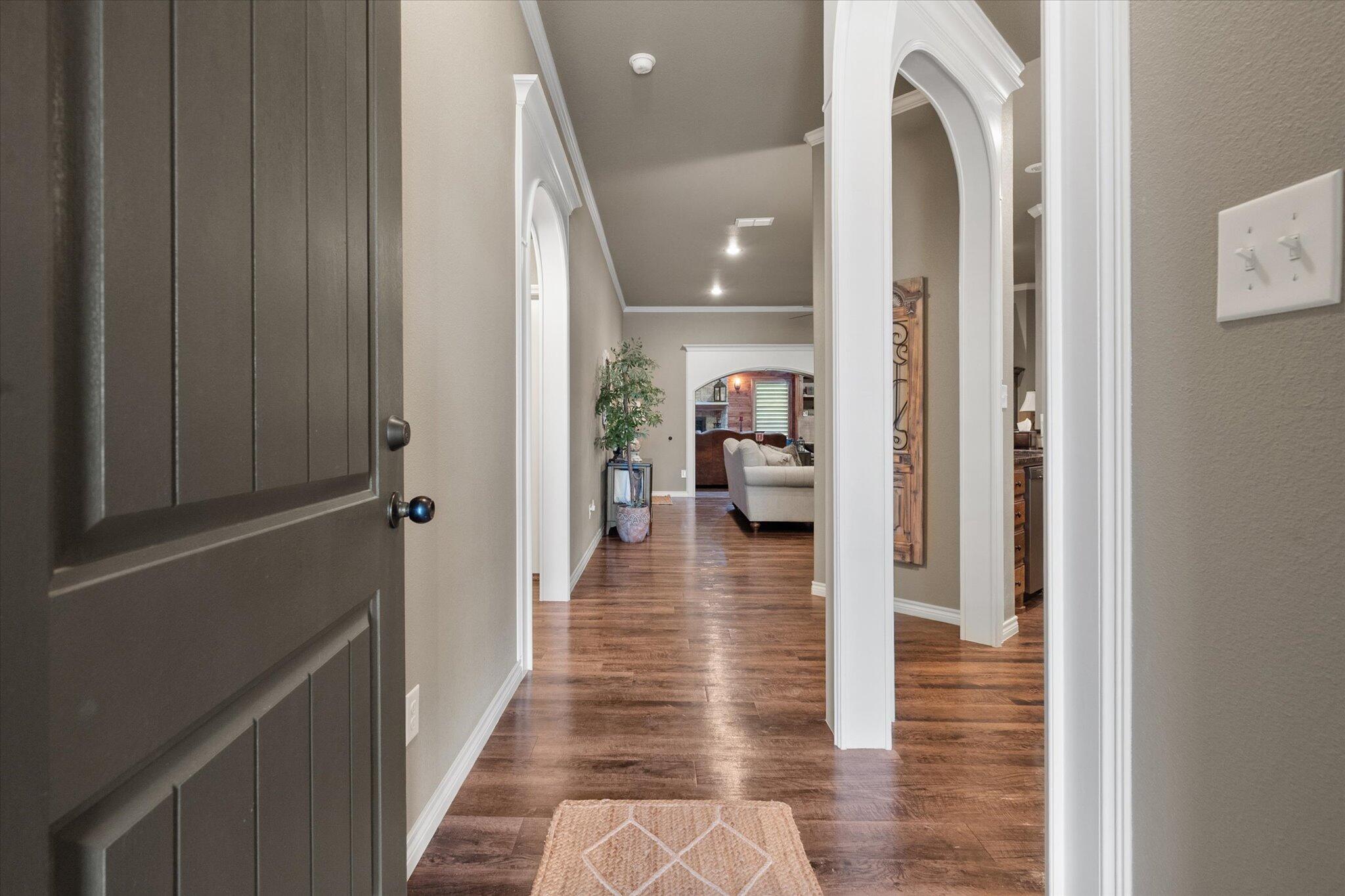 9606 Hope Avenue Lubbock, TX 79424 - Photo 5 of 35 a hallway with a view of living room