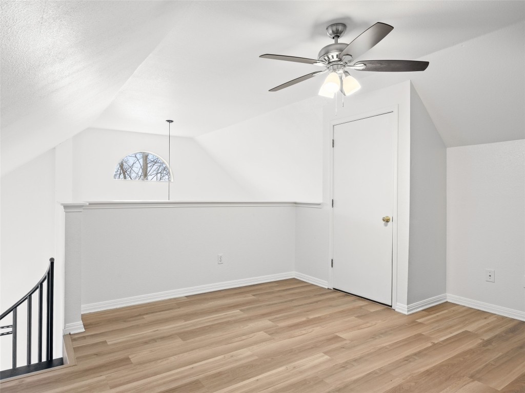 2908 Whisper Oaks Lane Georgetown, TX 78628 - Photo 26 of 32 an empty room with a window and a ceiling fan