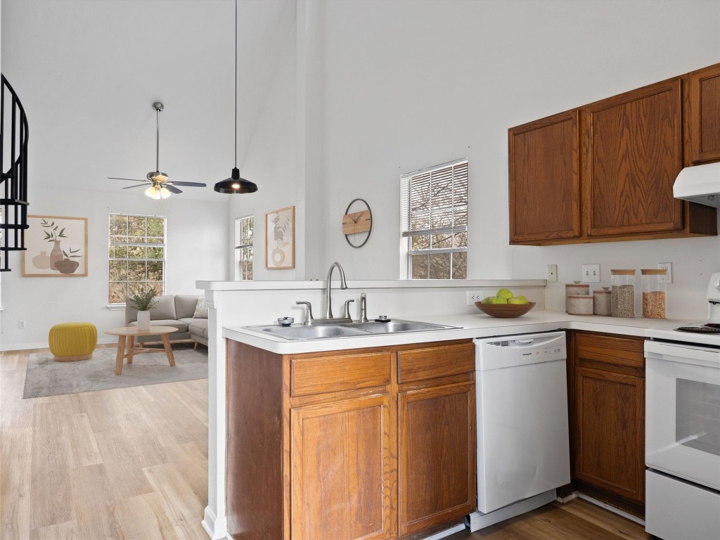 2908 Whisper Oaks Lane Georgetown, TX 78628 - Photo 3 of 32 a kitchen with a sink and cabinets