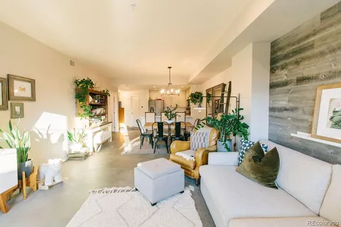a bedroom with a bed and a potted plant