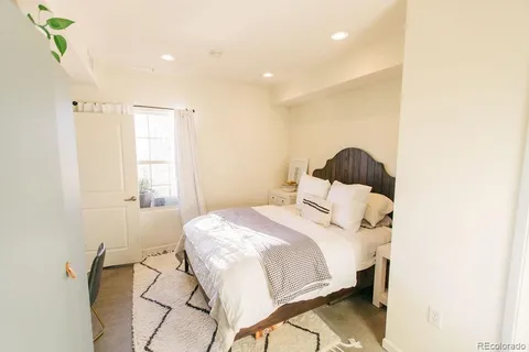 a bathroom with a sink mirror toilet and shower