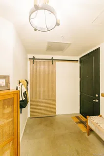 a bedroom with furniture and book shelf