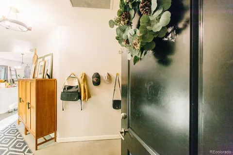 a bedroom with furniture and a book shelf