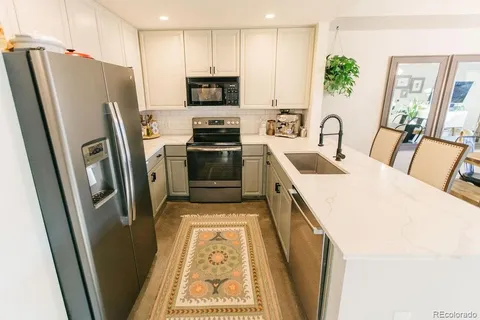 a kitchen with a stove and a sink