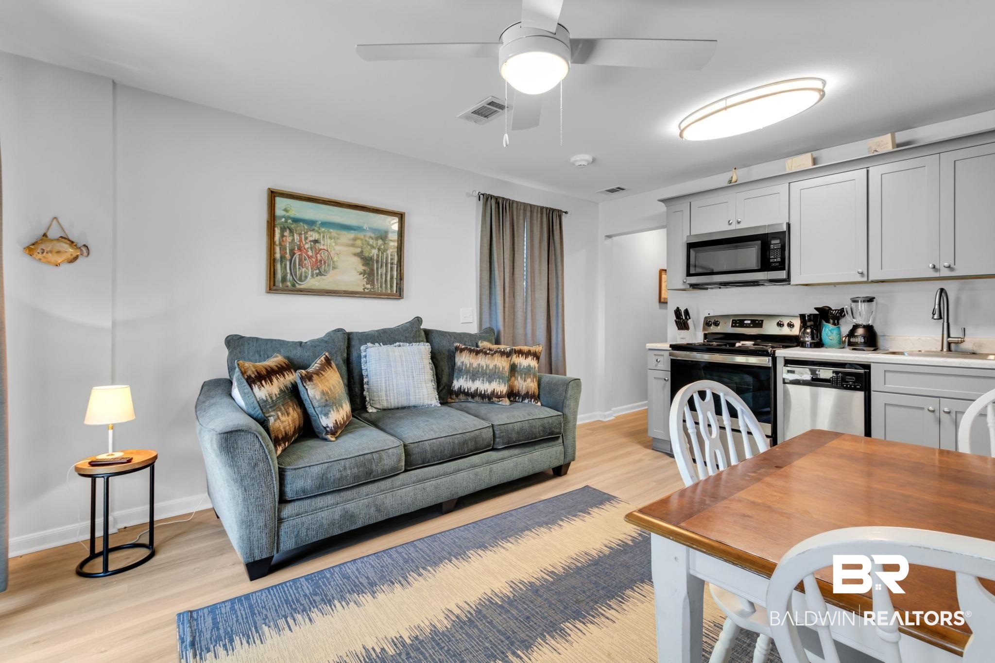400 Plantation Road, Unit 4115 Gulf Shores, AL 36542 - Photo 9 of 48 Living room with ceiling fan, sink, and light hardwood / wood-style floors