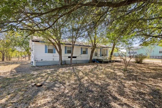 a house with trees in front of it