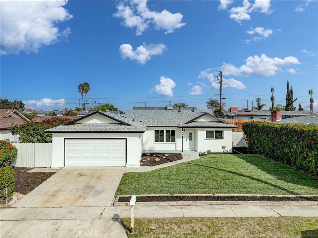 604 East Carter Street Rialto, CA 92376 - Photo 1 of 1 a front view of a house with garden