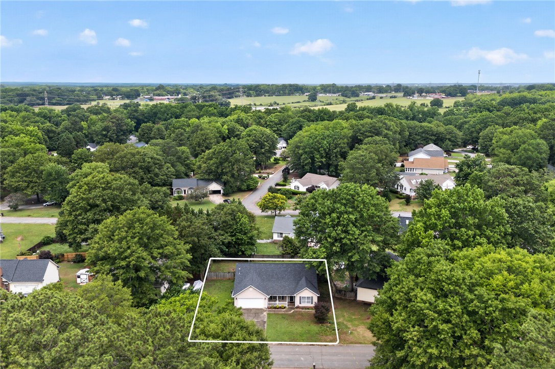 207 Hunters Lane Anderson, SC 29625 - Photo 32 of 46 An aerial perspective showcases a charming residence nestled amidst a verdant landscape.