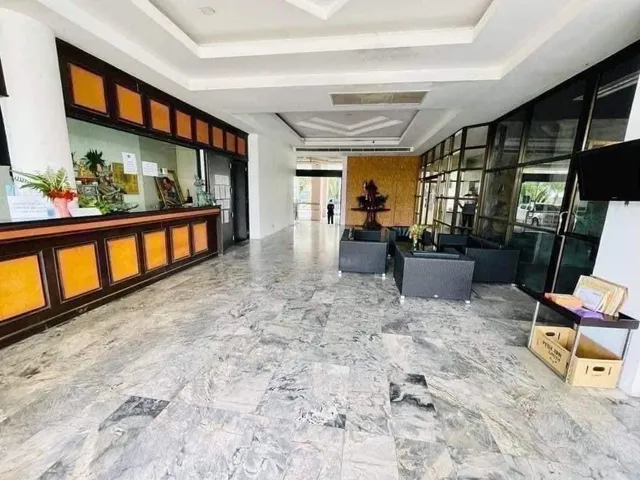 a lobby with furniture and window