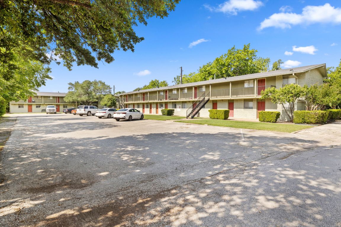 806 East 13th Street, Unit 105 Georgetown, TX 78626 - Photo 1 of 25 a view of a building with a street