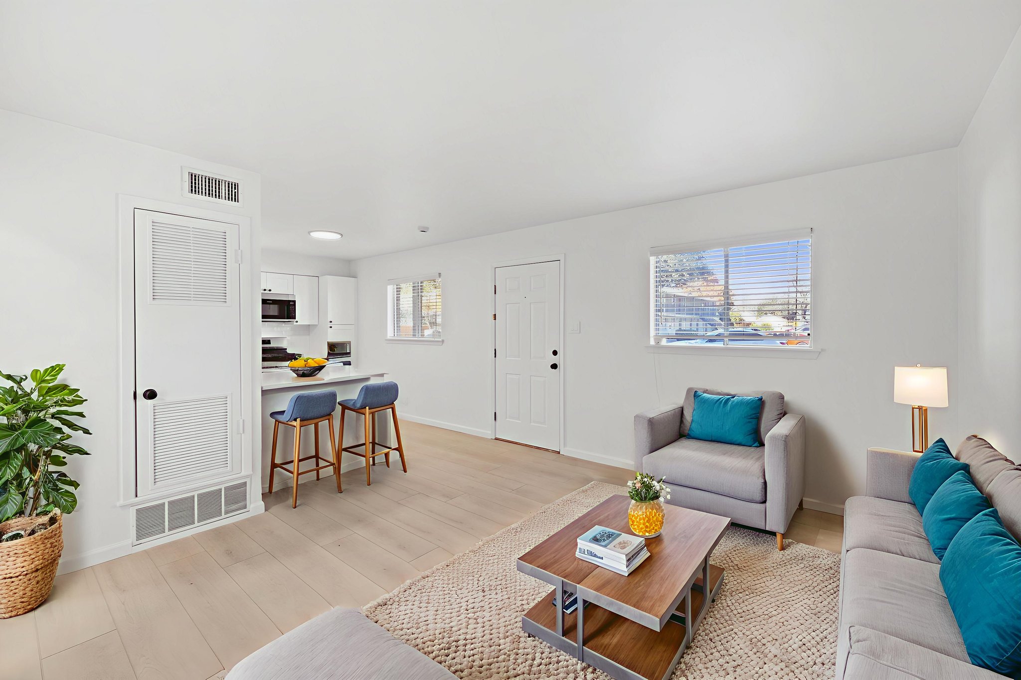 806 East 13th Street, Unit 108 Georgetown, TX 78626 - Photo 1 of 1 Living area featuring light wood finished floors and baseboards