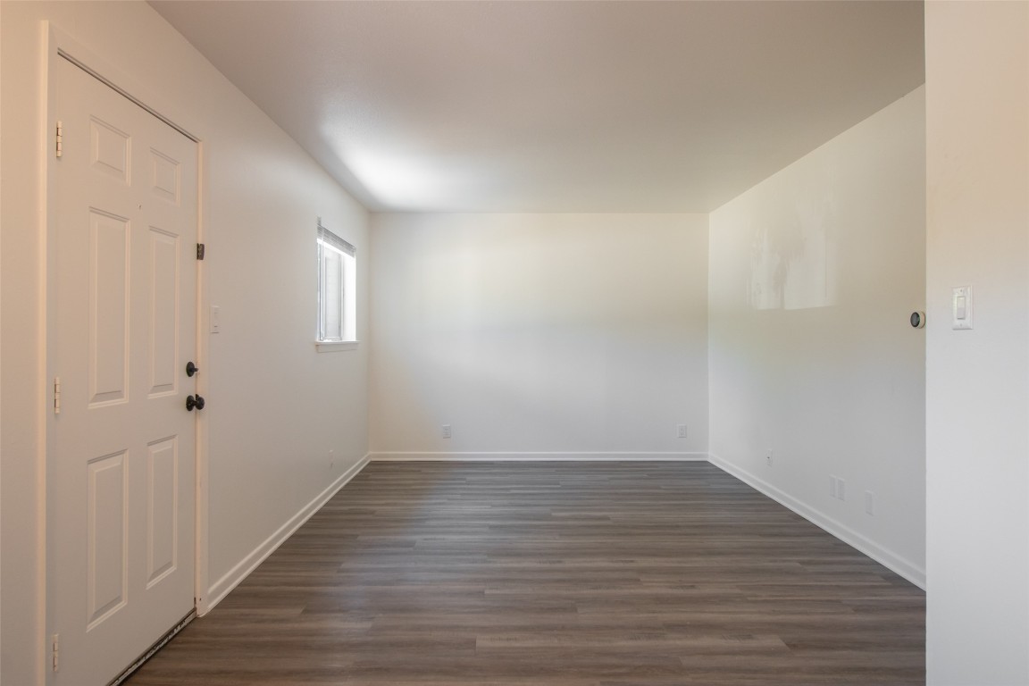 806 East 13th Street, Unit 105 Georgetown, TX 78626 - Photo 13 of 25 a view of an empty room with wooden floor