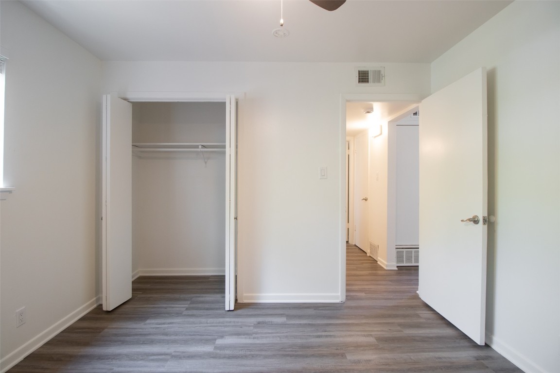 806 East 13th Street, Unit 105 Georgetown, TX 78626 - Photo 22 of 25 a view of entryway with wooden floor
