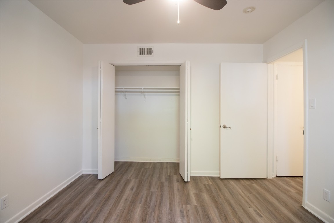 806 East 13th Street, Unit 105 Georgetown, TX 78626 - Photo 24 of 25 a view of an empty room with wooden floor