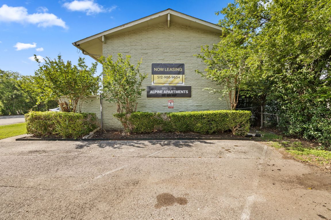 806 East 13th Street, Unit 105 Georgetown, TX 78626 - Photo 4 of 25 a front view of a house with a yard