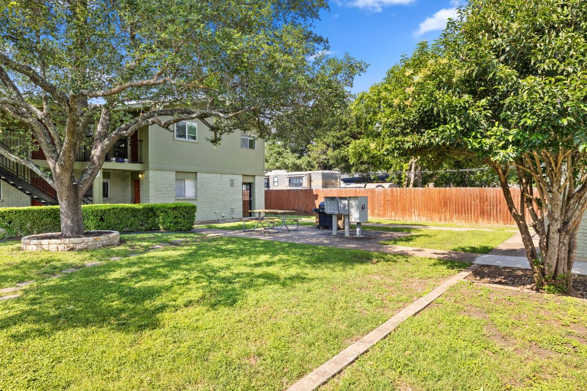 806 East 13th Street, Unit 105 Georgetown, TX 78626 - Photo 5 of 25 a view of backyard with swimming pool