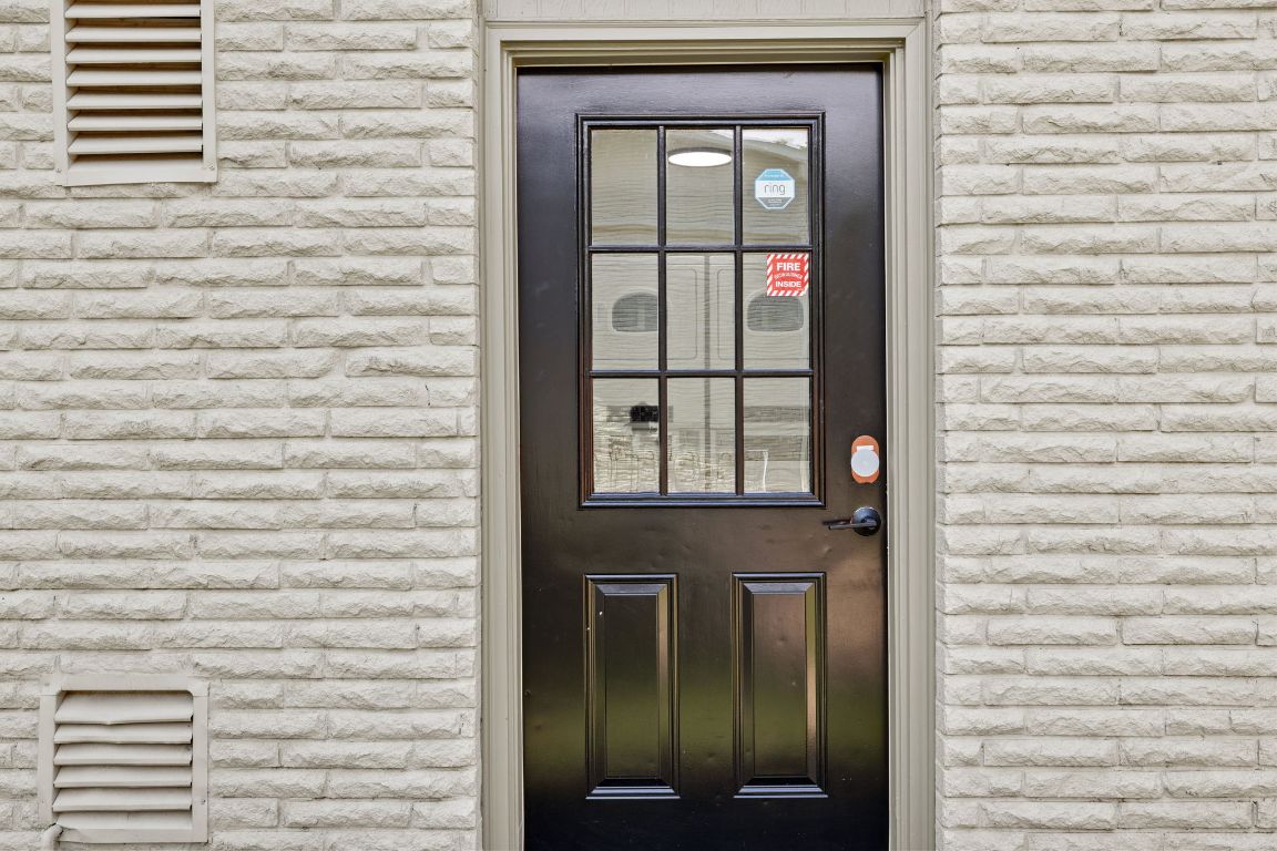 806 East 13th Street, Unit 105 Georgetown, TX 78626 - Photo 7 of 25 a view of entryway with a brick wall