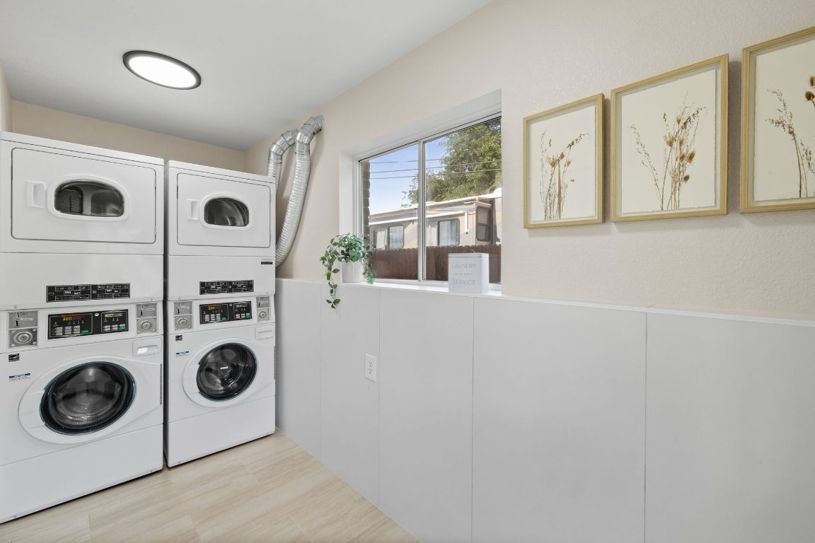 806 East 13th Street, Unit 105 Georgetown, TX 78626 - Photo 8 of 25 Laundry area with stacked washing machine and dryer
