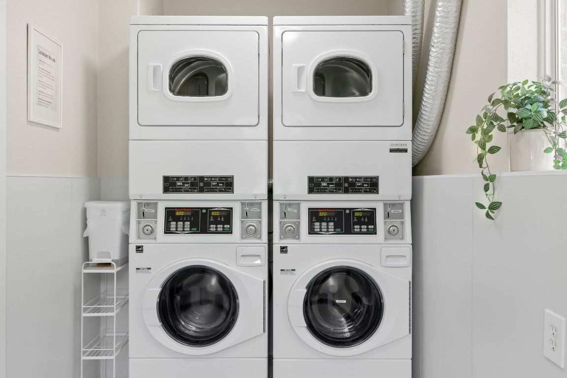 806 East 13th Street, Unit 105 Georgetown, TX 78626 - Photo 9 of 25 a utility room with dryer and washer