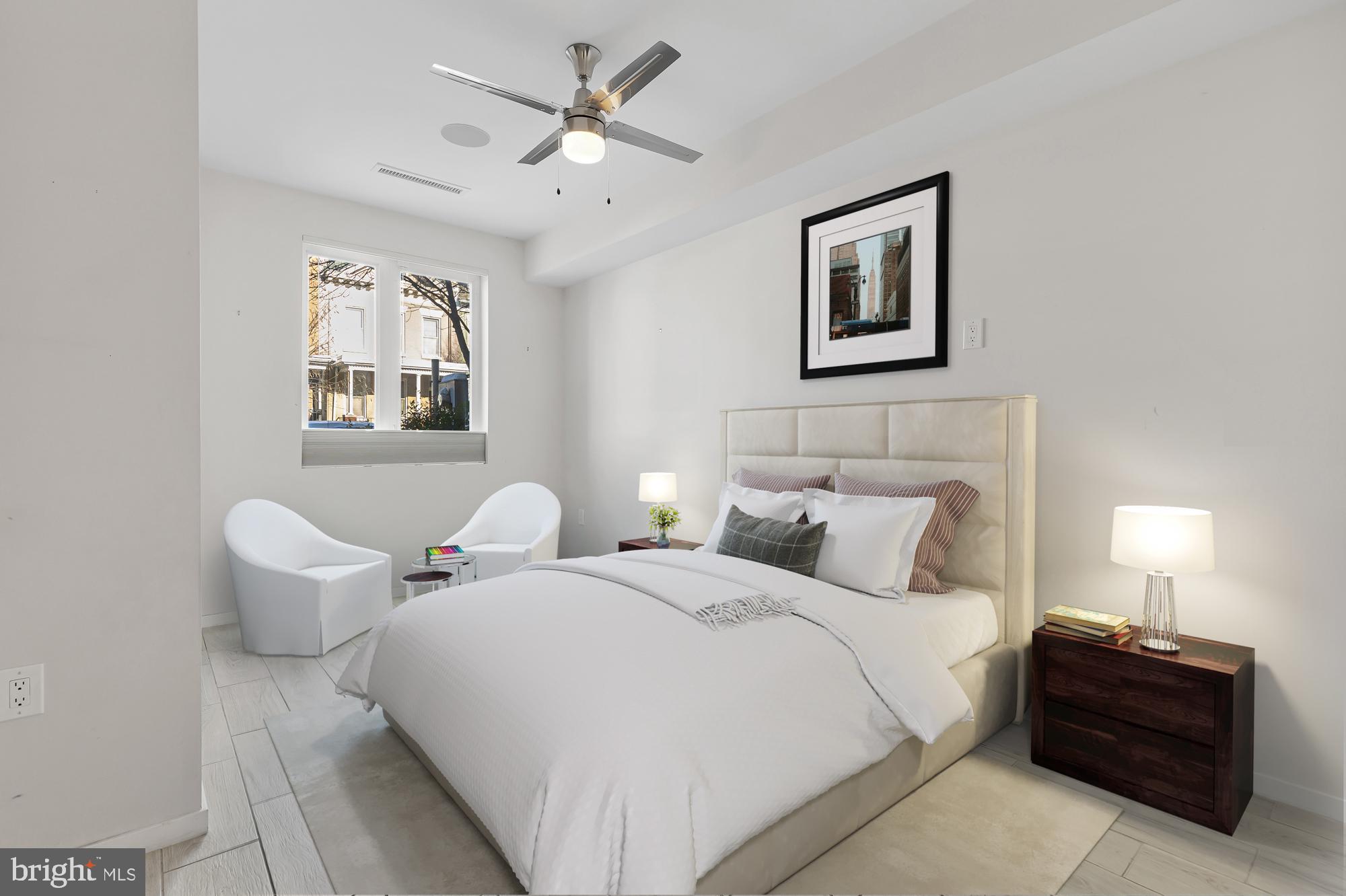 756 Park Road Northwest, Unit 1 Washington, DC 20010 - Photo 12 of 25 a bedroom with two beds and painting on the wall