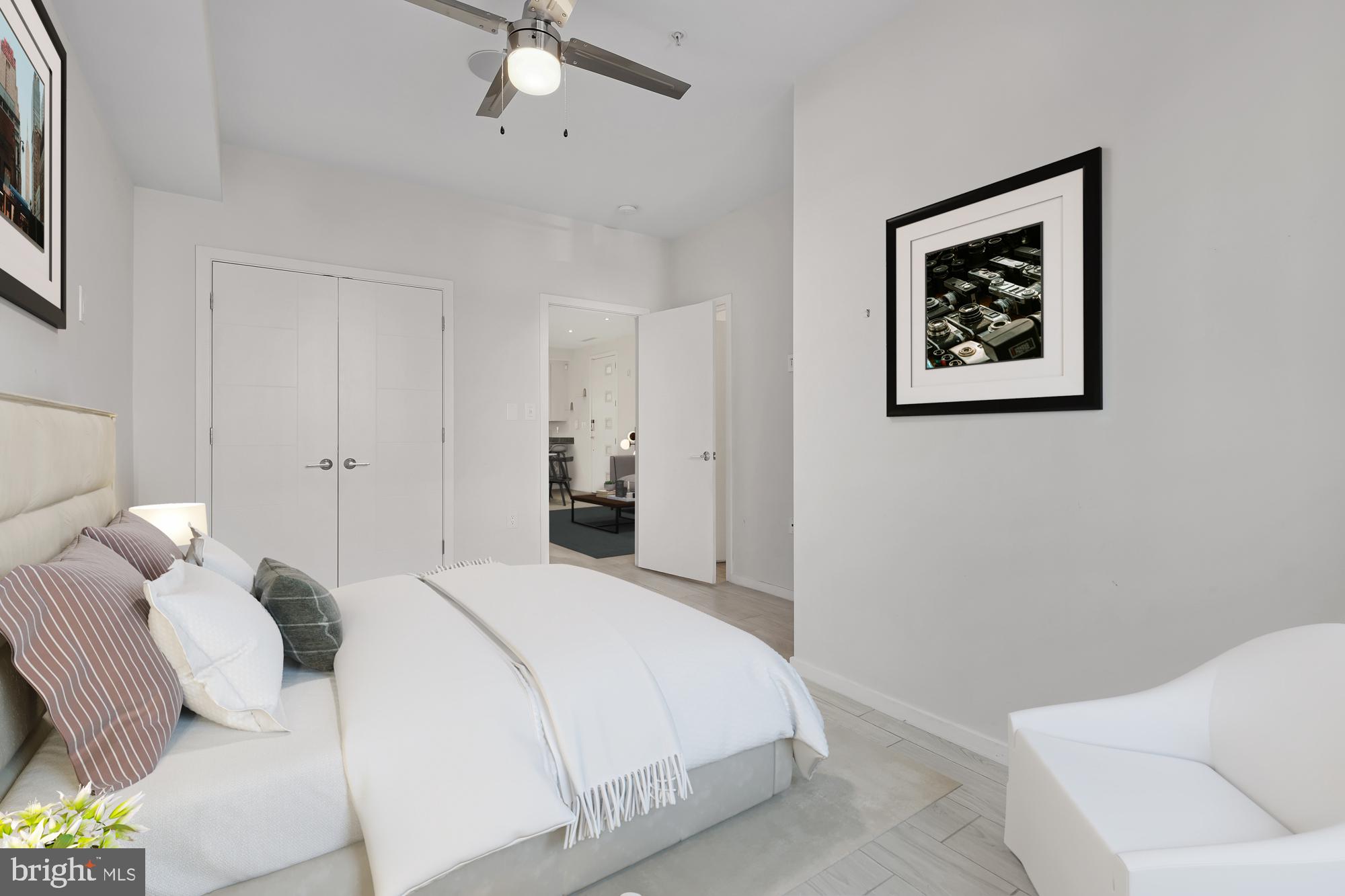 756 Park Road Northwest, Unit 1 Washington, DC 20010 - Photo 14 of 25 a bedroom with a bed and a couch