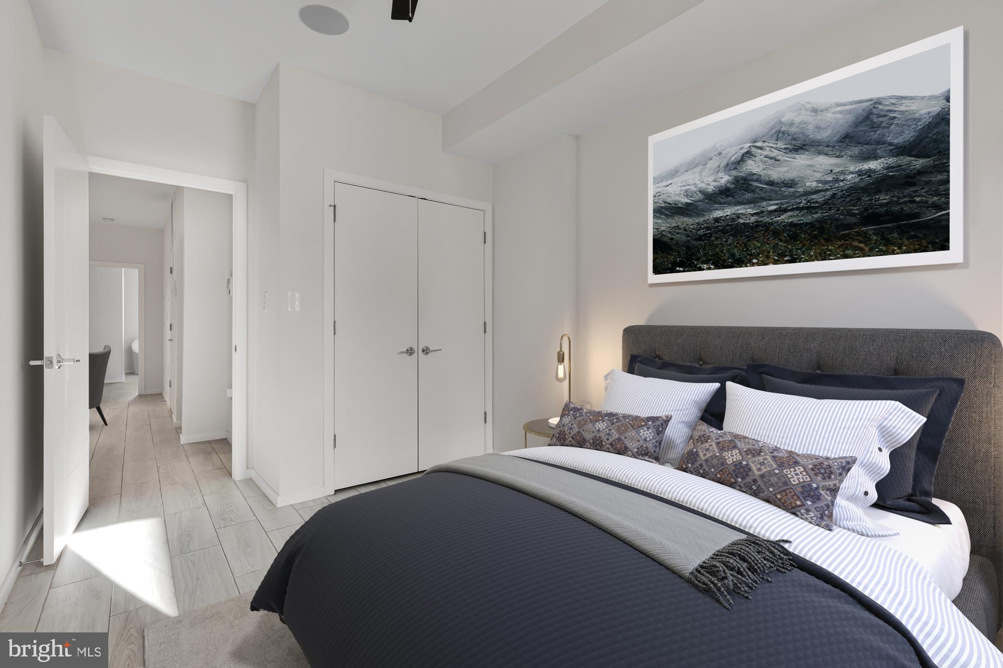 756 Park Road Northwest, Unit 1 Washington, DC 20010 - Photo 20 of 25 a bedroom with a bed and a painting on the wall