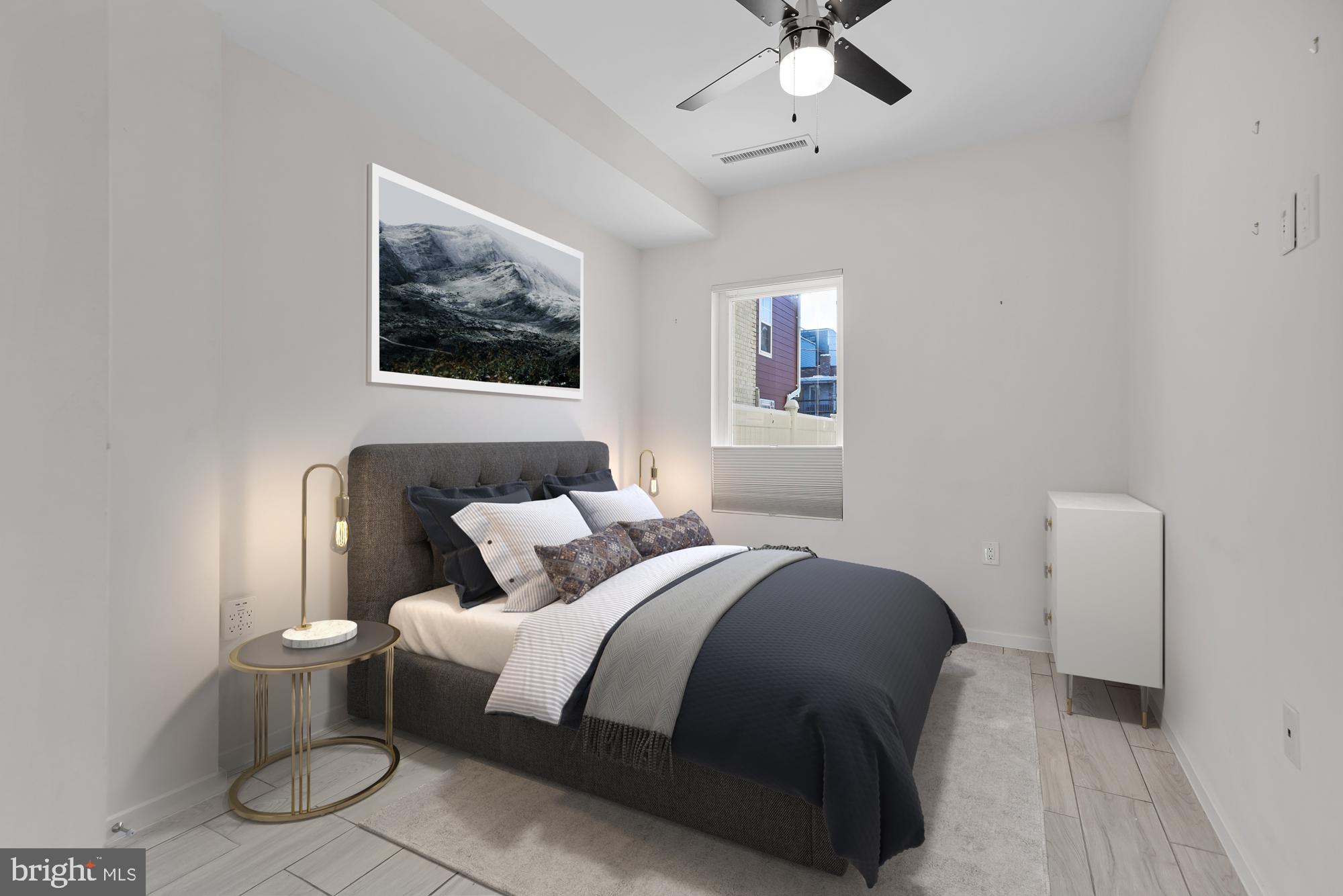 756 Park Road Northwest, Unit 1 Washington, DC 20010 - Photo 22 of 25 a bedroom with a bed and a painting on the wall