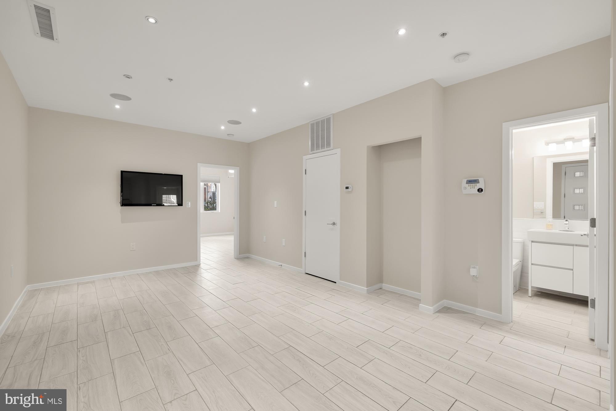 756 Park Road Northwest, Unit 1 Washington, DC 20010 - Photo 23 of 25 a view of a livingroom with wooden floor and cabinet