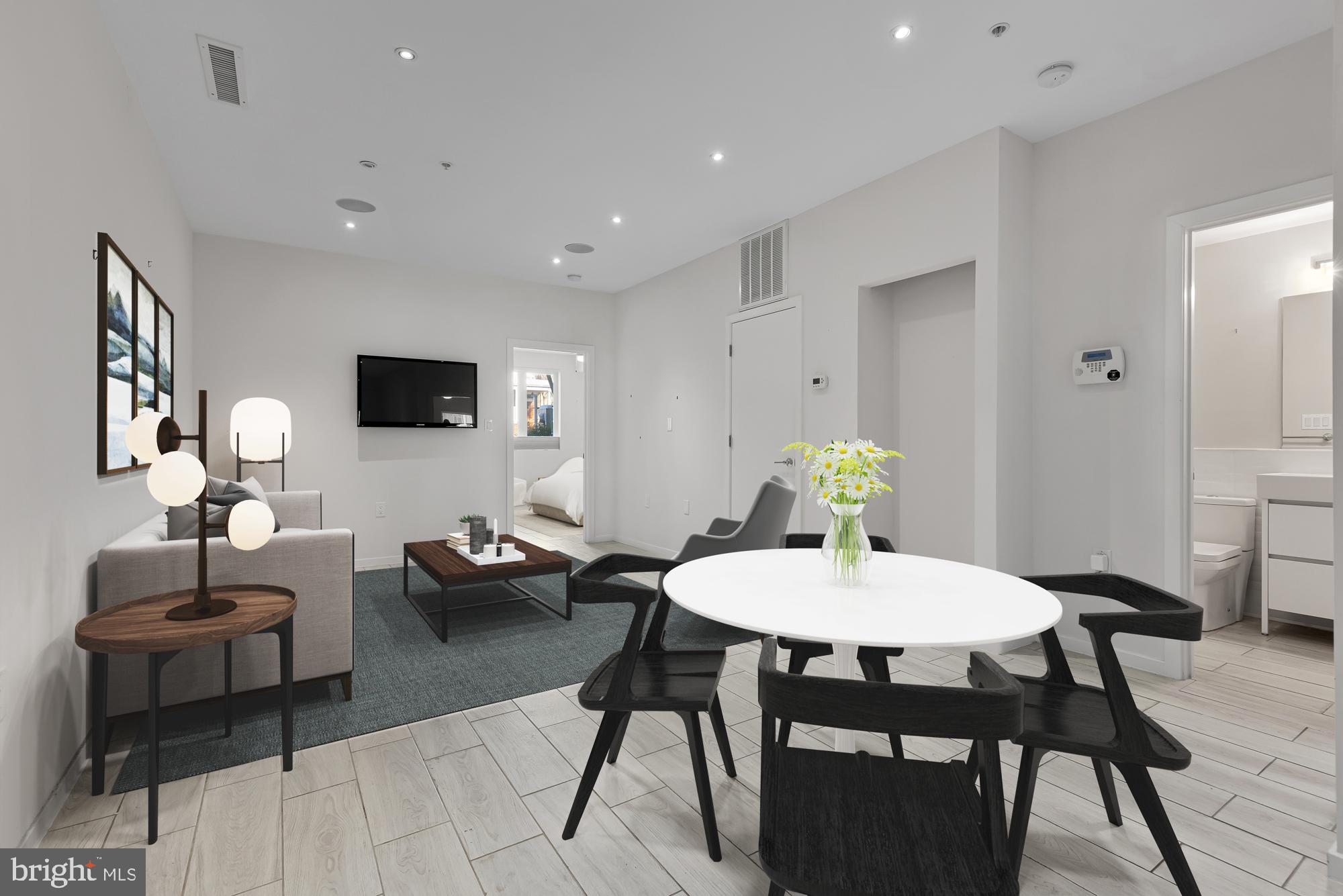 756 Park Road Northwest, Unit 1 Washington, DC 20010 - Photo 10 of 25 a dining room with furniture and wooden floor