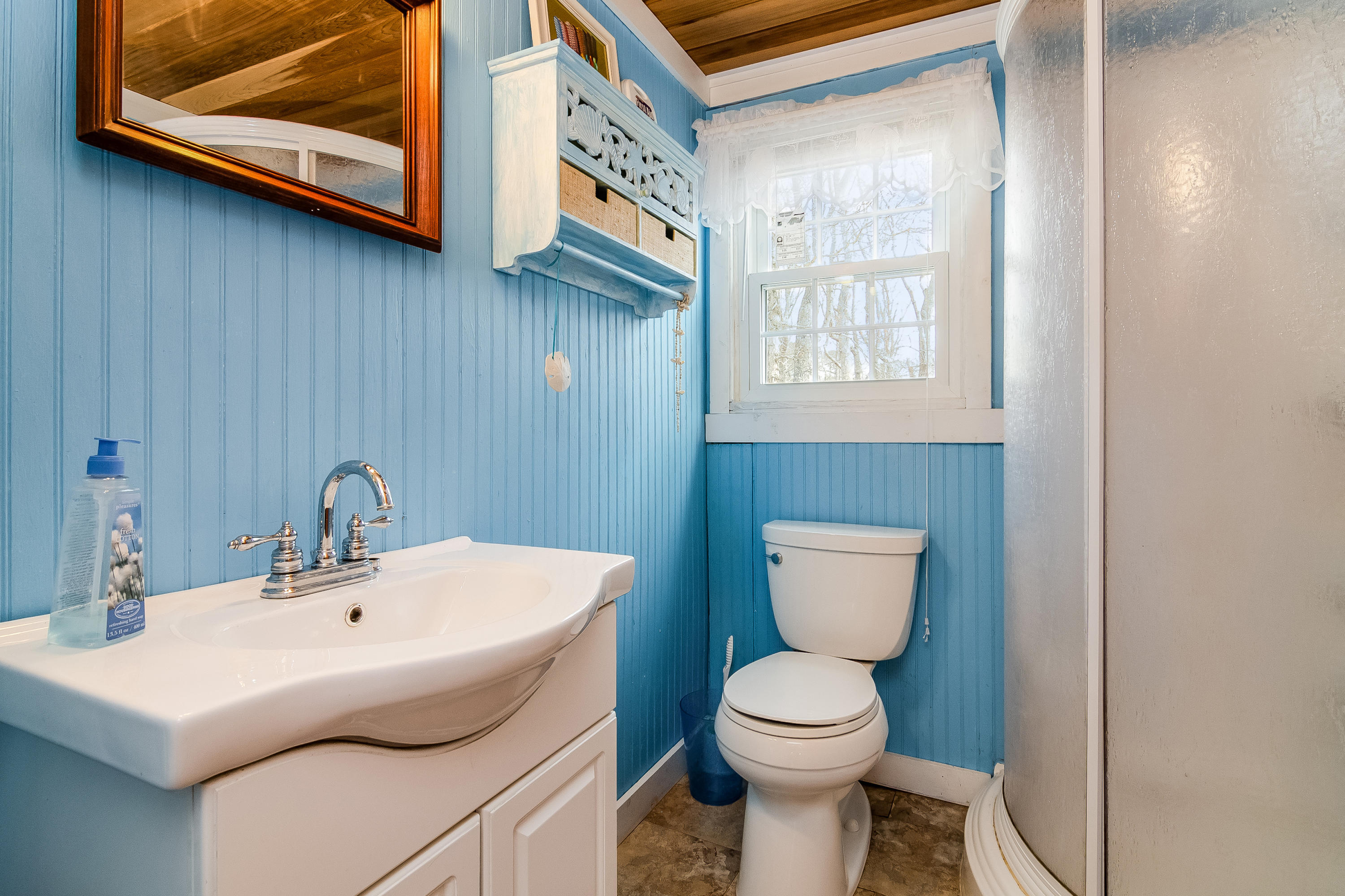 20 Hidden Lane Eastham, MA 02642 - Photo 13 of 21 a bathroom with a toilet a sink and mirror
