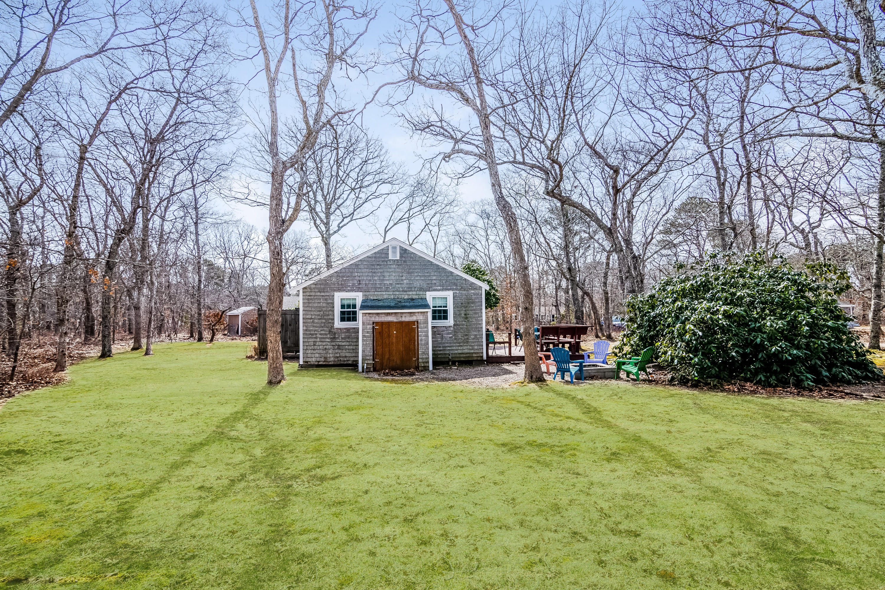 20 Hidden Lane Eastham, MA 02642 - Photo 19 of 21 a view of a house with a yard and trees