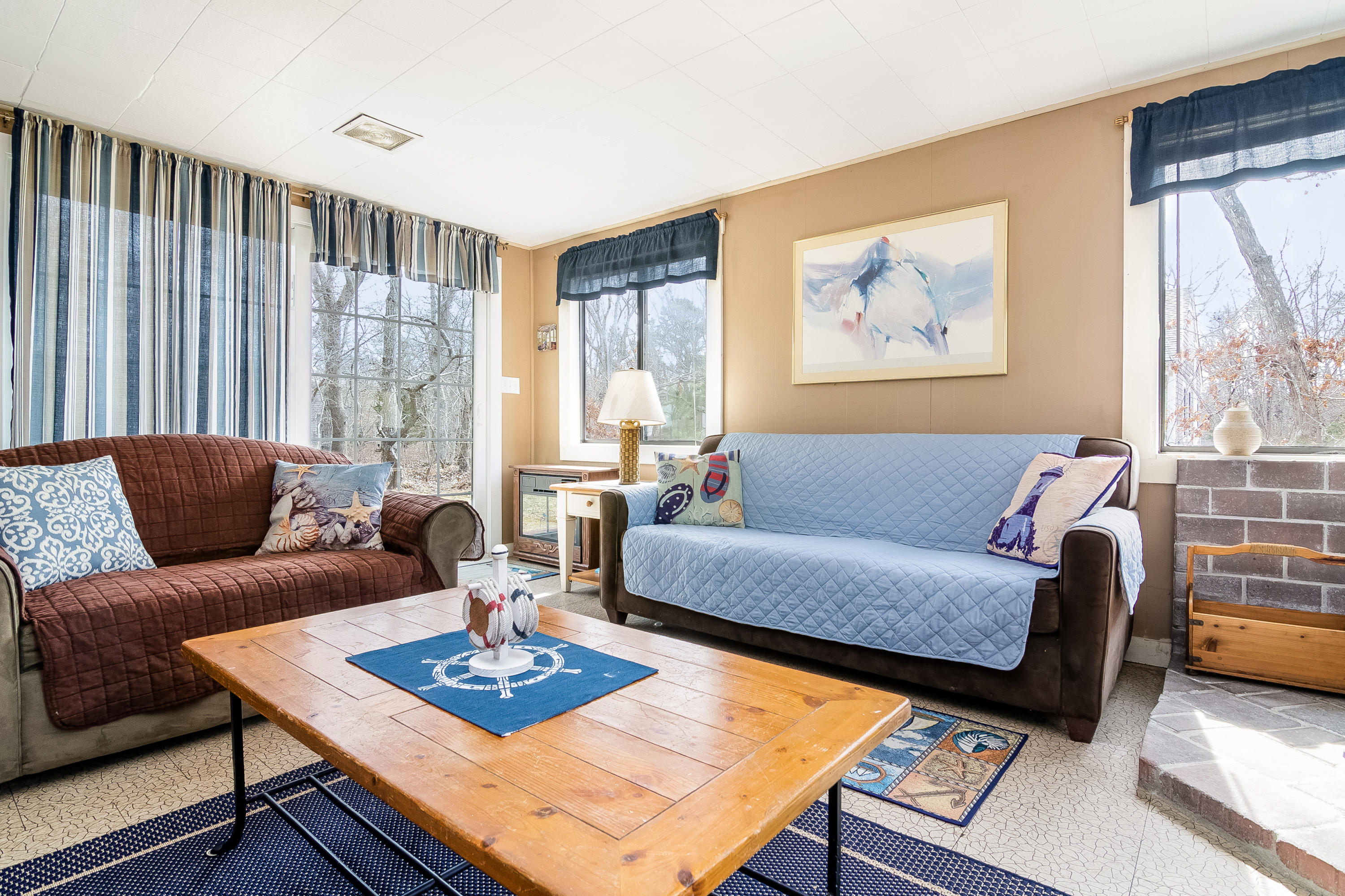 20 Hidden Lane Eastham, MA 02642 - Photo 4 of 21 a living room with furniture a table and a large window