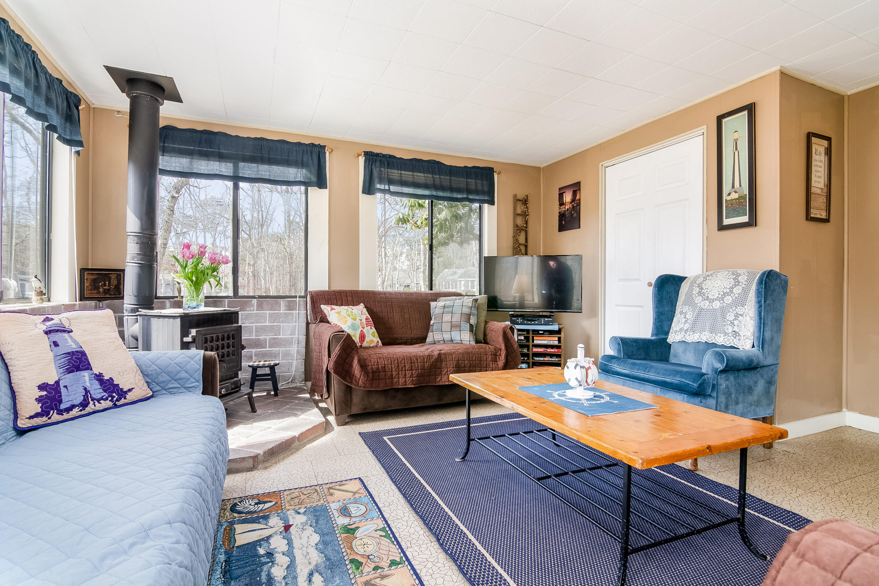 20 Hidden Lane Eastham, MA 02642 - Photo 5 of 21 a living room with furniture fireplace and a large window