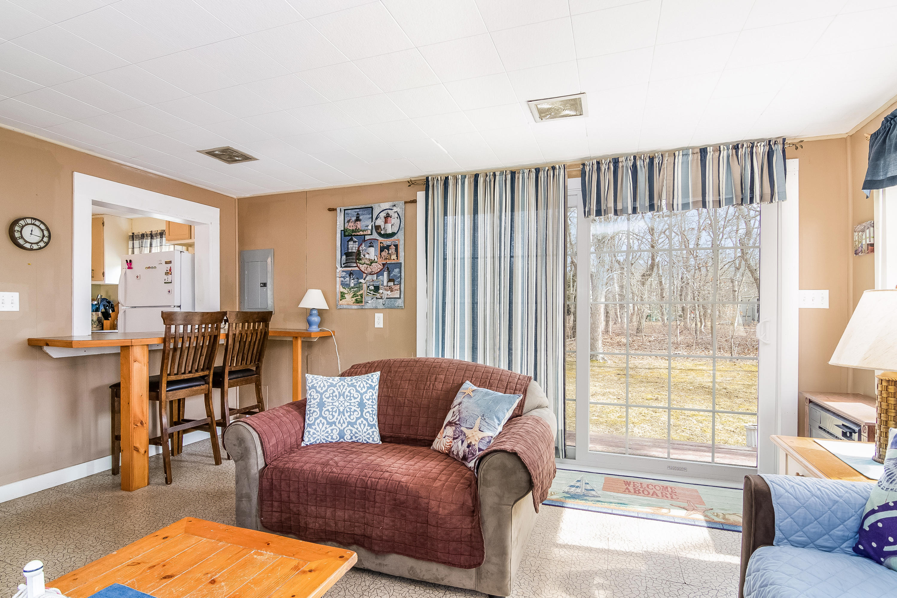 20 Hidden Lane Eastham, MA 02642 - Photo 6 of 21 a living room with furniture and a large window