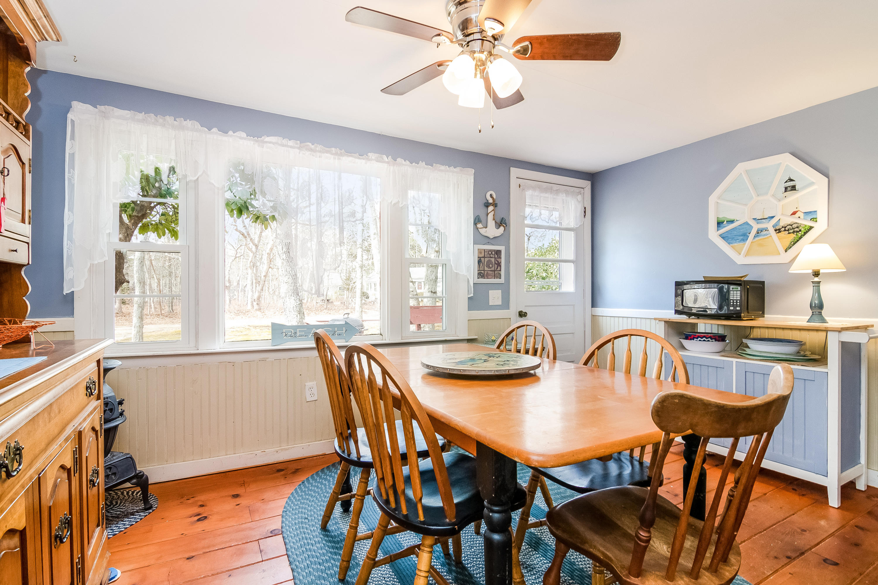 20 Hidden Lane Eastham, MA 02642 - Photo 7 of 21 a view of a dining room with furniture and chandelier