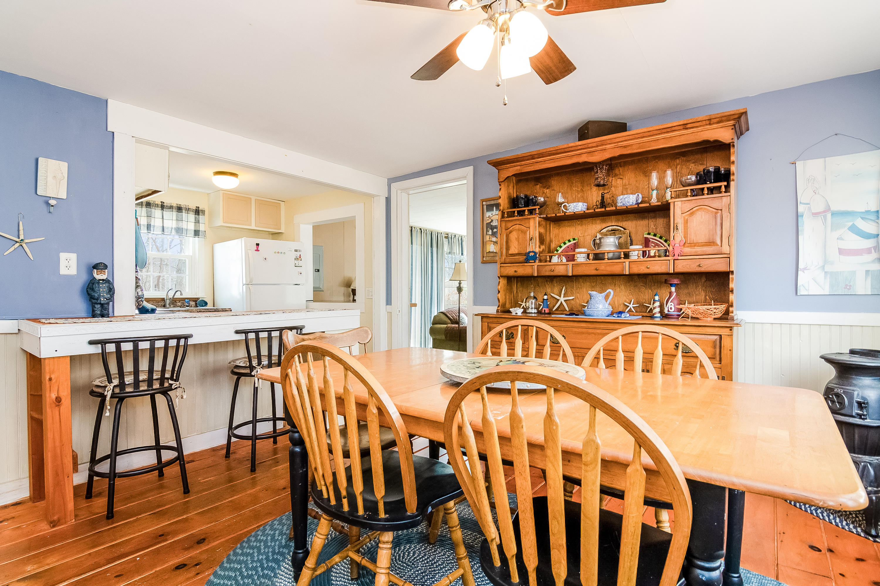 20 Hidden Lane Eastham, MA 02642 - Photo 9 of 21 a dinning area with table chairs and wooden floor