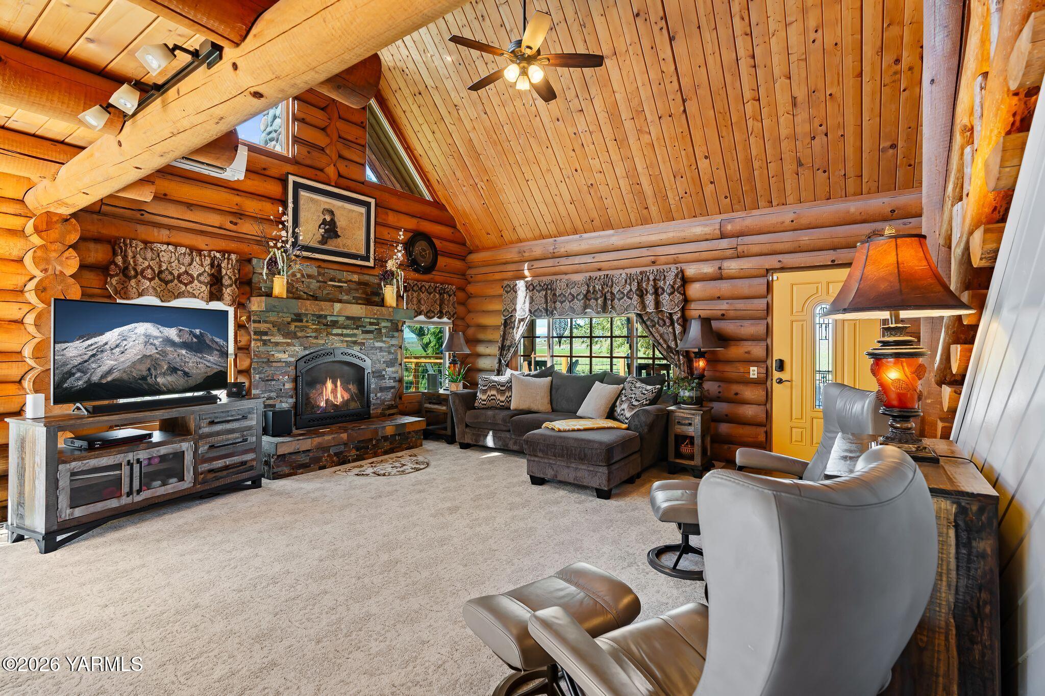 2550 Kays Road Wapato, WA 98951 - Photo 7 of 52 a living room with furniture a fireplace and a window