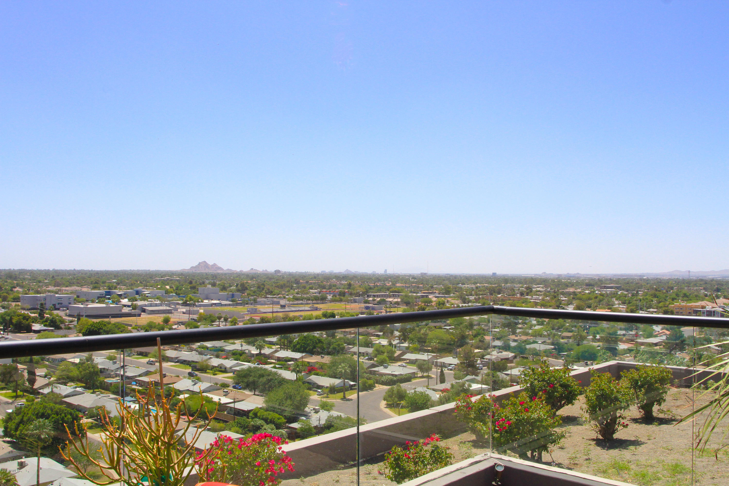 4808 North 24th Street, Unit 605 Phoenix, AZ 85016 - Photo 1 of 27 a view of a city and an ocean view