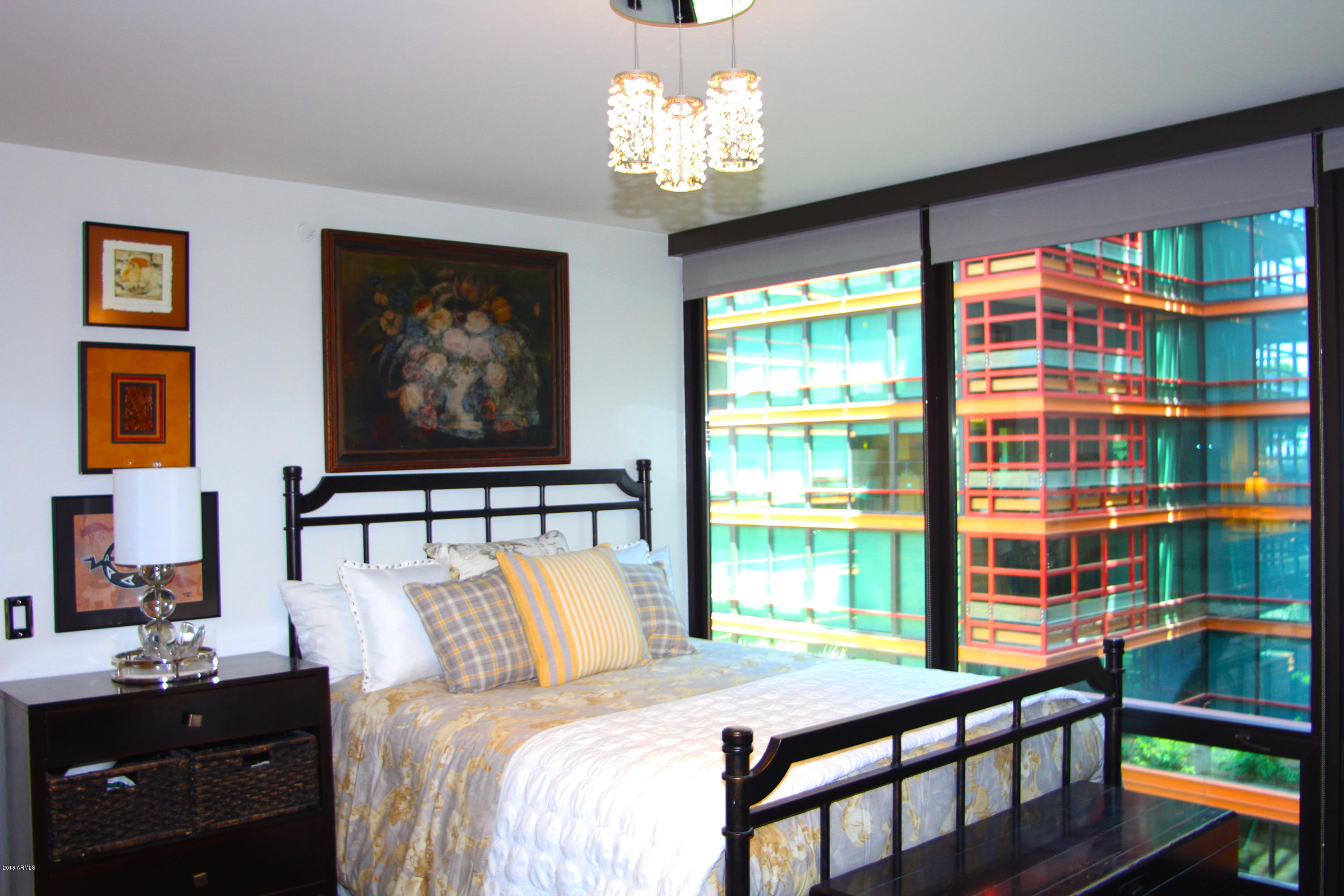 4808 North 24th Street, Unit 605 Phoenix, AZ 85016 - Photo 11 of 27 a bedroom with a bed and a window