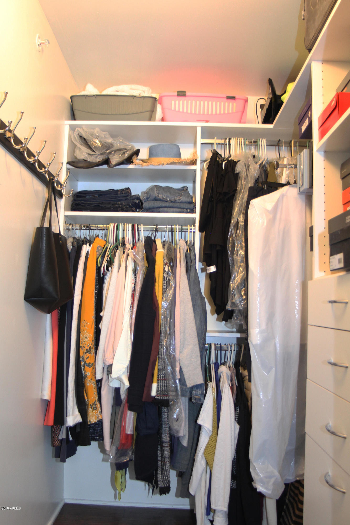 4808 North 24th Street, Unit 605 Phoenix, AZ 85016 - Photo 13 of 27 a view of walk in closet with clothes and shoes
