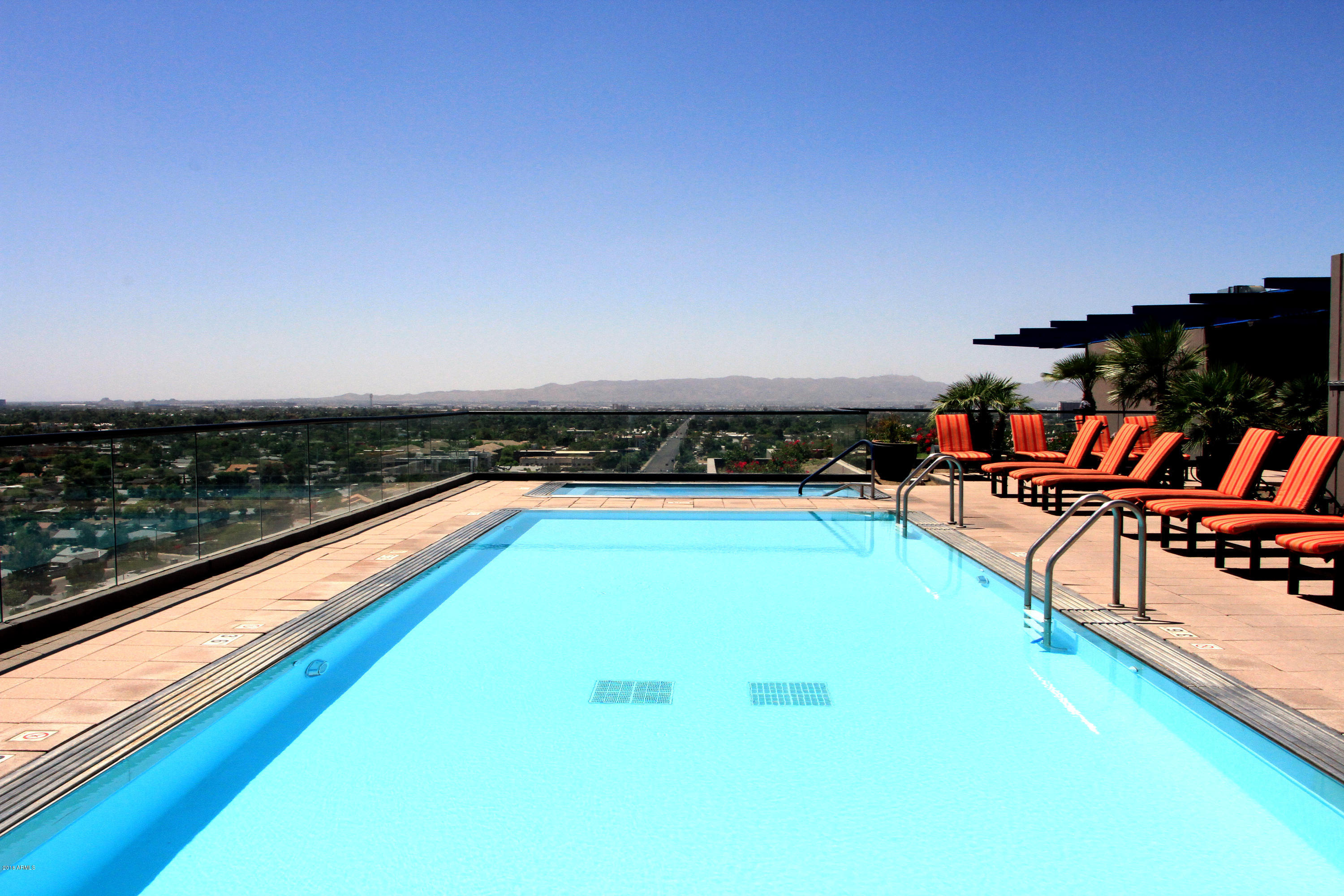 4808 North 24th Street, Unit 605 Phoenix, AZ 85016 - Photo 23 of 27 wooden view of swimming pool with seating area