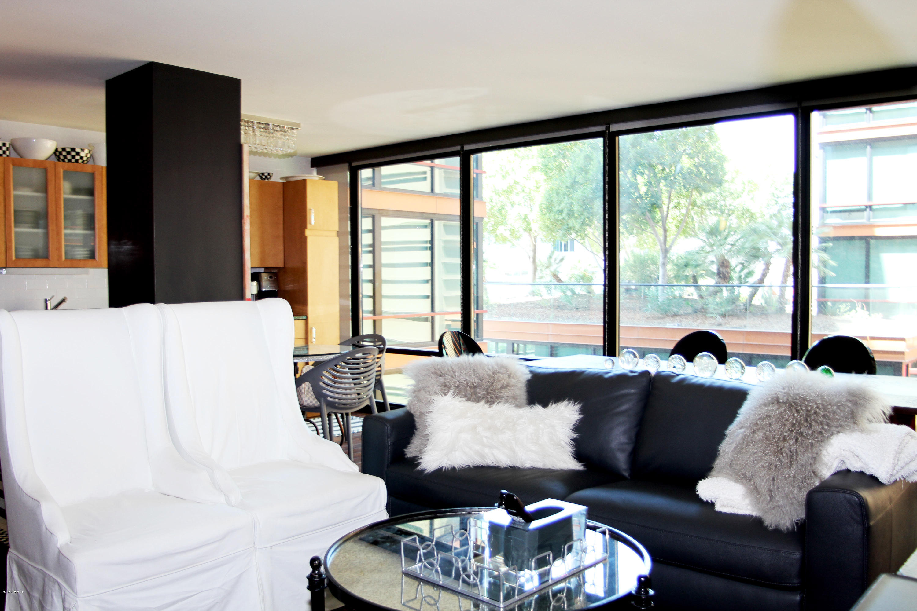 4808 North 24th Street, Unit 605 Phoenix, AZ 85016 - Photo 3 of 27 a living room with furniture and a large window