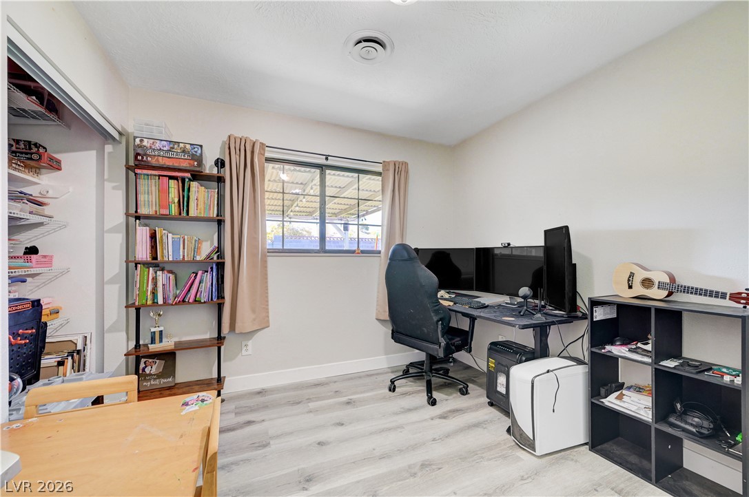 1331 Pinto Road Boulder City, NV 89005 - Photo 29 of 46 Well-lit room featuring durable flooring and convenient built-in shelving.