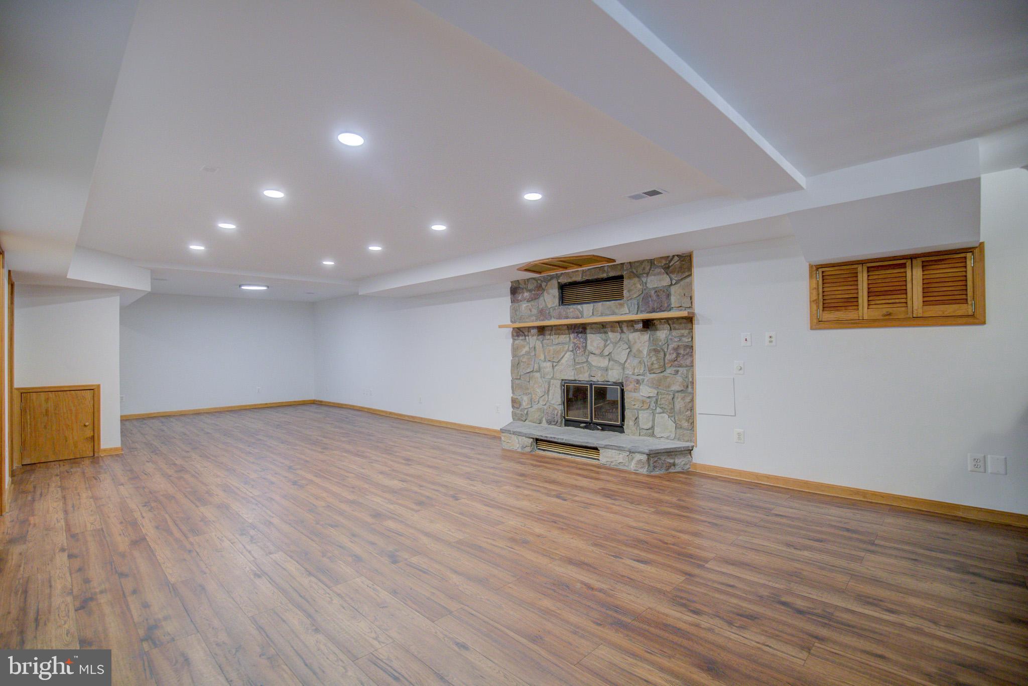 813 Blacks Hill Road Great Falls, VA 22066 - Photo 56 of 92 Spacious LL Rec. Rm. w/ Stone Fireplace!