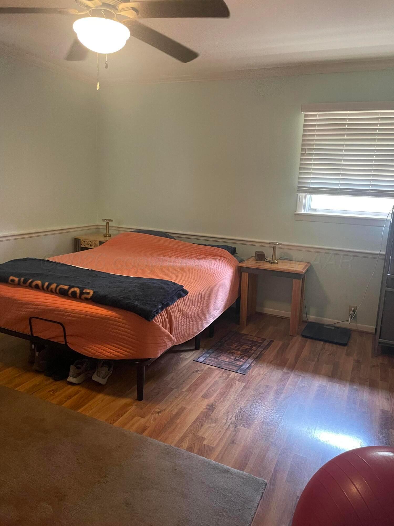 6200 Hanson Road Amarillo, TX 79106 - Photo 12 of 22 a room with wooden floor and furniture
