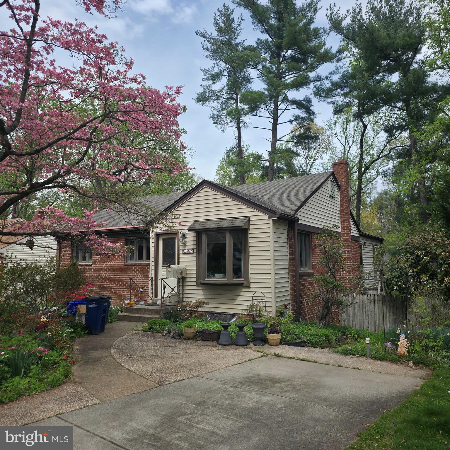 4068 Adams Drive Silver Spring, MD 20902 - Photo 1 of 43 a front view of a house with a yard and trees