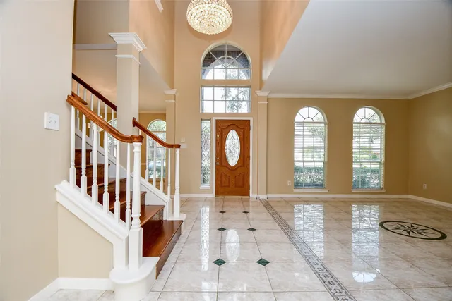 a view of an entryway with wooden floor