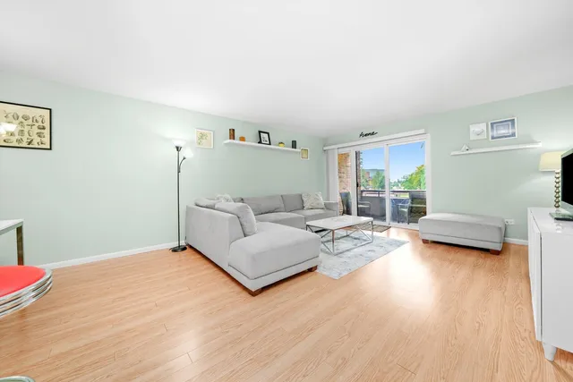 a bedroom with furniture and a wooden floor