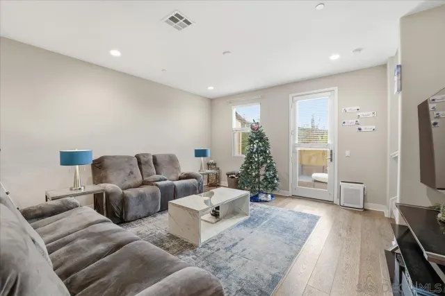 a bed room with two beds and a chair